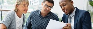 Businessman Talking to Clients About Benefits