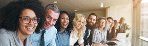 Cheerful Multiracial Colleagues Looking at Camera in Office